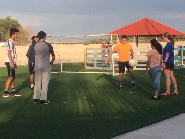 group playing soccer in Mexico
