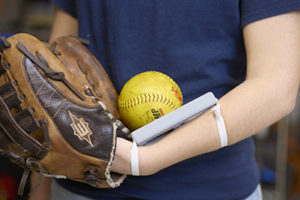 photo of baseball glove, ball, and device