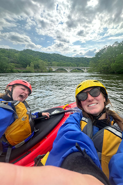 Engineering students kayak down the river at the Student Outdoor Leadership Experience.