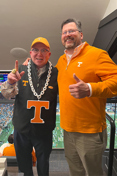 K. Scott Malone and Mench at a UT football game.