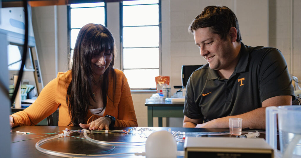 Bryan Good works with a student in his Dougherty lab.