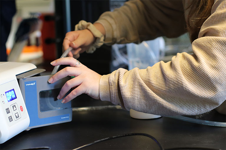 Moser connects her resin model to a computational fluid dynamics model to collect data.