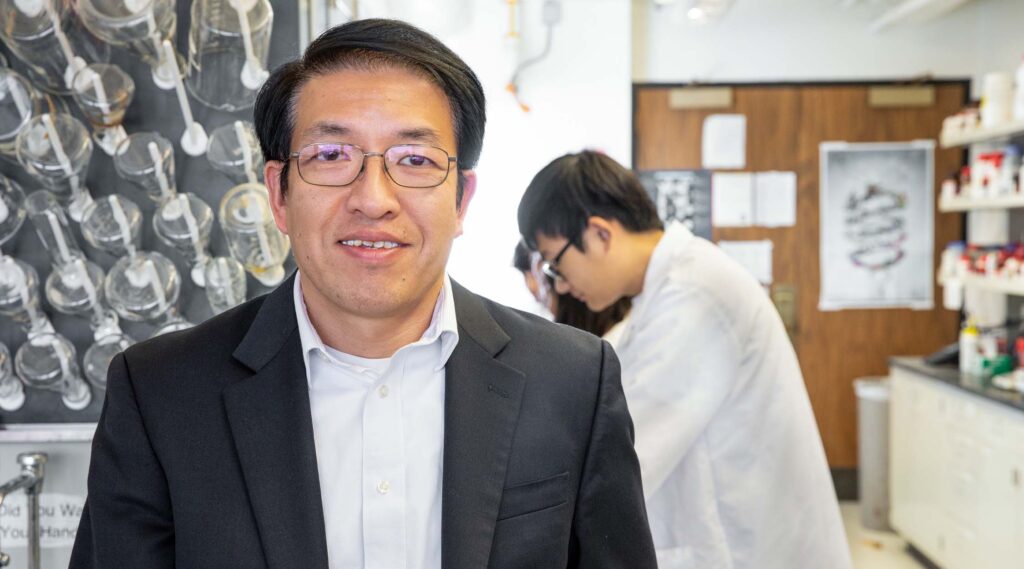 Dacheng Ren stands in front of lab